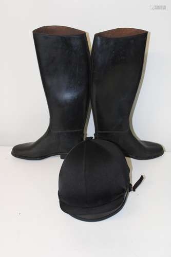 A pair of riding boots size 5 & safety helmet size 3