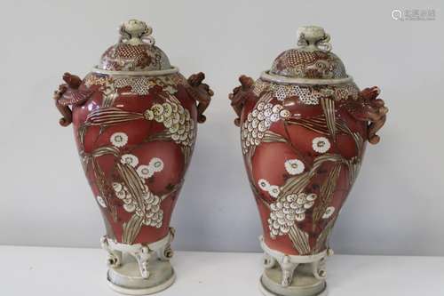 A pair of large lidded ewers with pheonix handles. One has b...