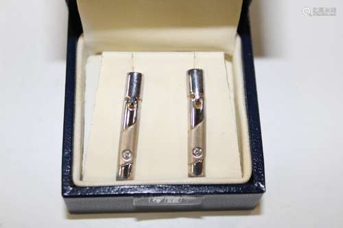 A pair of Royal Mint silver & diamond earrings