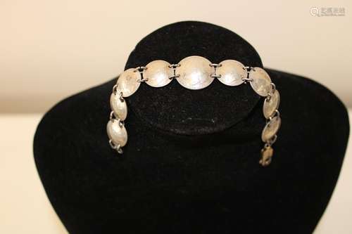 A vintage silver coin bracelet