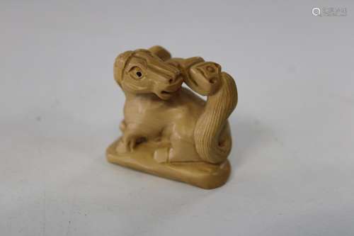 A Chinese box wood netsuke