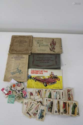 A collection of loose stamps & cigarette cards & albums