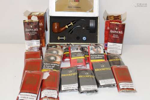 A large job lot of pipe tobacco with an electronic pipe