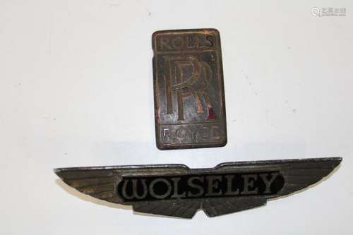 A vintage Rolls Royce & Wolsey car emblem