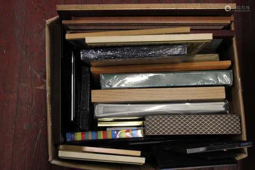 A box of assorted picture frames etc