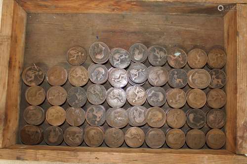 A wooden box full of old one pennies