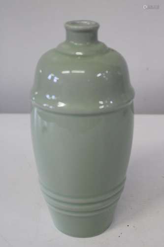 A Chinese green celadon vase of unusual form, with character...