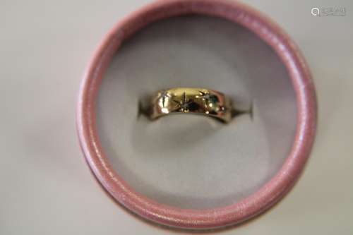 A 9ct gold white sapphire band ring size K