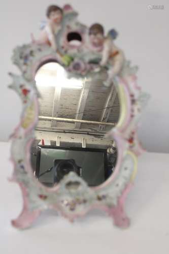 A antique Dresden porcelain mirror. Sold as seen h47cm