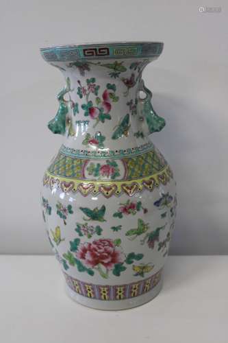 A large Chinese porcelain butterfly vase with foo dog handle...