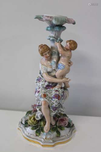 A Dresden porcelain Candle stick. Sold as seen. h34cm