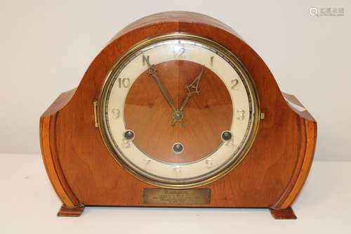 A vintage wooden mantel clock