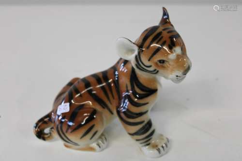 A Russian tiger cub figure 13x17cm