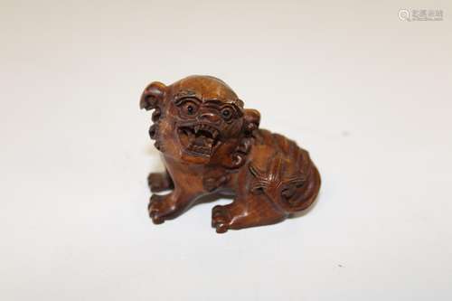 A Chinese box wood netsuke