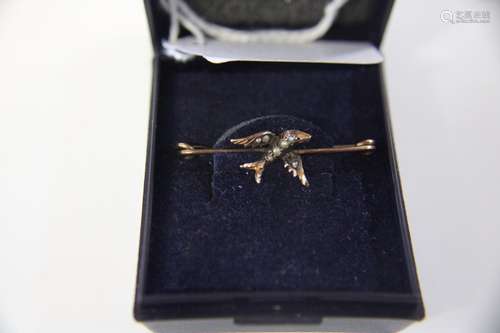 A 9ct gold & seed pearl brooch in the form of a bird