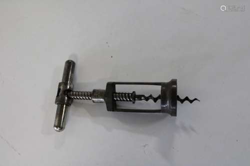 A antique metal cork screw