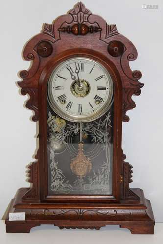 An antique American Ginger Bread striking mantel clock in GW...