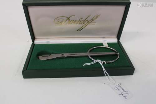 A boxed Davidoff cigar cuter in it's original fitted case