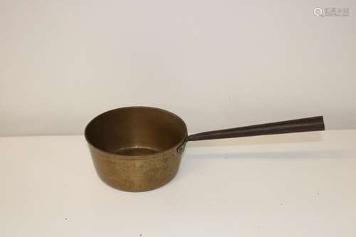 A heavy brass jam pan