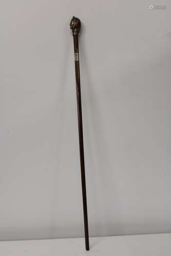 A quality hallmarked silver collared walking cane with brass...