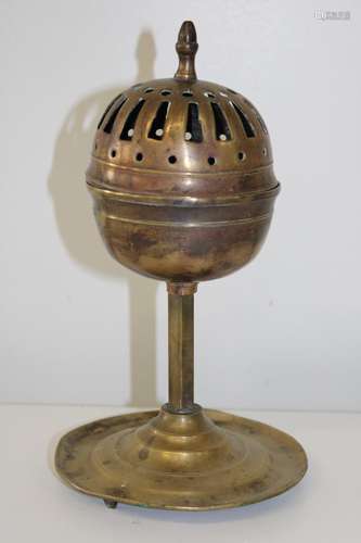 An Islamic brass incense burner