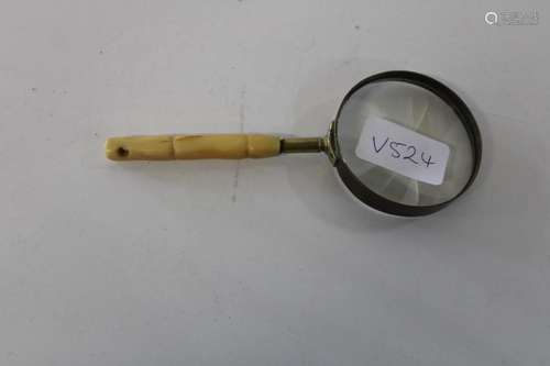 A vintage bone handled magnifying glass 16cm tall