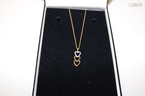 A 9ct gold triple heart pendant & chain