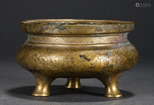 A CHINESE INCISED BRONZE GILT TRIPOD CENSER