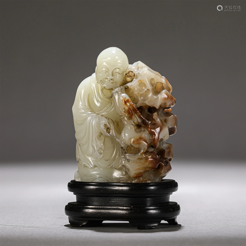 A CHINESE CARVED WHITE JADE OF ARHAT WITH DRAGON