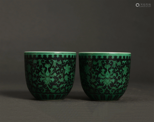 PAIR OF BLACK GROUND GREEN ENAMELED FLOWERS CUPS