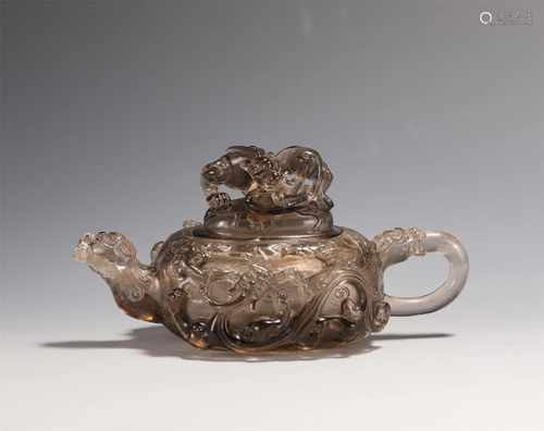 A CHINESE CARVED SMOKY QUARTZ BEAST TEA POT