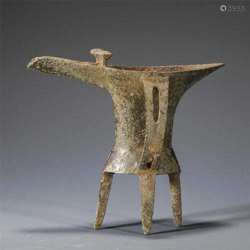 A CHINESE BRONZE TRIPOD JUE WINE VESSEL