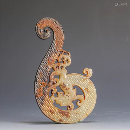 A CHINESE CARVED COILED JADE DRAGON