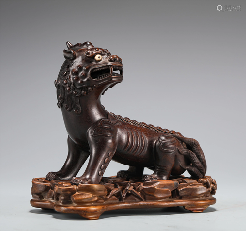 A CARVED ROSEWOOD BEAST DECORATION