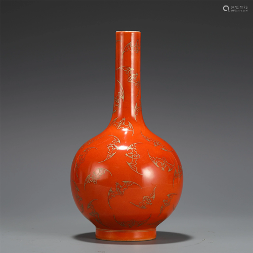 A CHINESE RED GLAZE AND GILT BOTTLE VASE