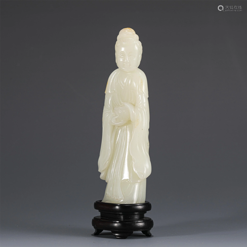 A CHINESE CARVED WHITE JADE STANDING IMMORTAL