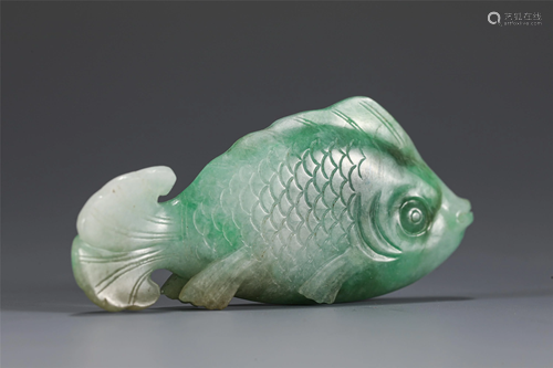 A CHINESE CARVED JADEITE CARP PENDANT