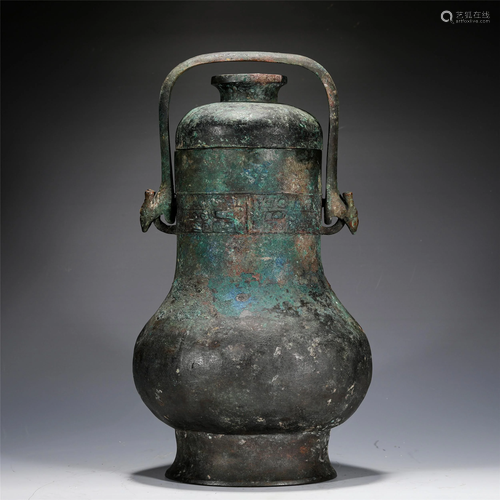 A CHINESE LOOP-HANDLED BRONZE WINE VESSEL HU