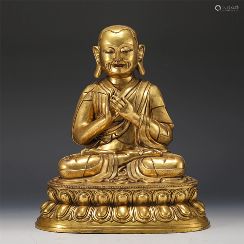 A TIBETAN GILT BRONZE MASTER GURU