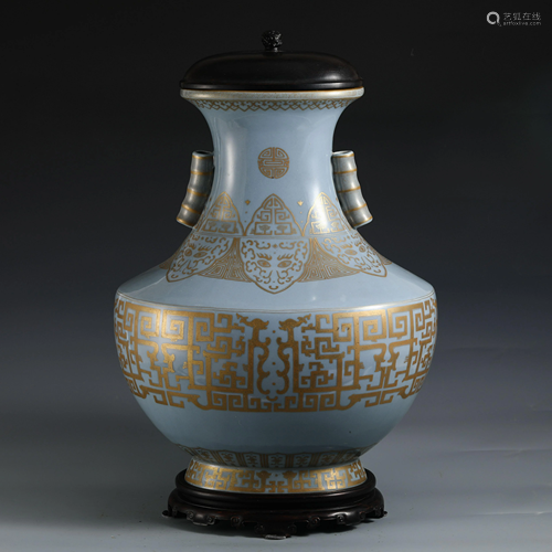 A CHINESE SKY BLUE GLAZE ANND GILT ZUN VASE