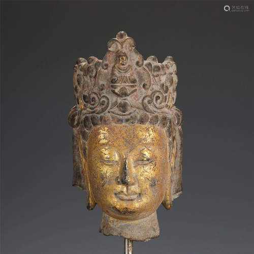 A CHINESE CARVED STONE BUDDHA HEAD WITH GOLD PAINTED