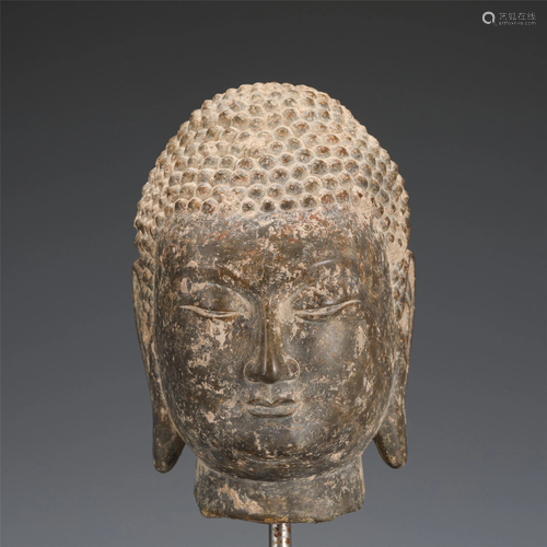 A CHINESE CARVED STONE BUDDHA HEAD