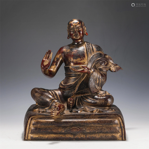 A CHINESE BRONZE SEATED MASTER GURU