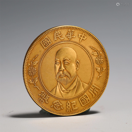 A CHINESE COMMEMORATIVE COIN