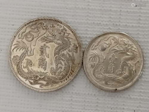 TWO CHINESE OLD SILVER COINS