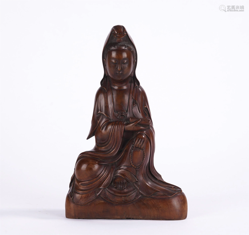 A CHINESE CARVED HARDWOOD BUDDHA STATUETTE