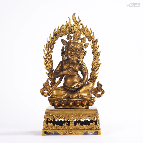 A GILT BRONZE FIGURE OF JAMBHALA