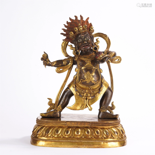 A TIBETAN GILT-BRONZE STANDING MAHAKALA