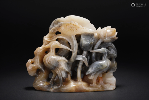 A CHINESE CARVED JADE LOTUS AND BIRDS DECORATION