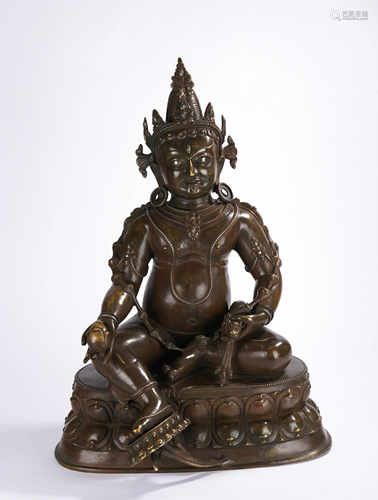 A TIBETAN BRONZE SEATED JAMBHALA